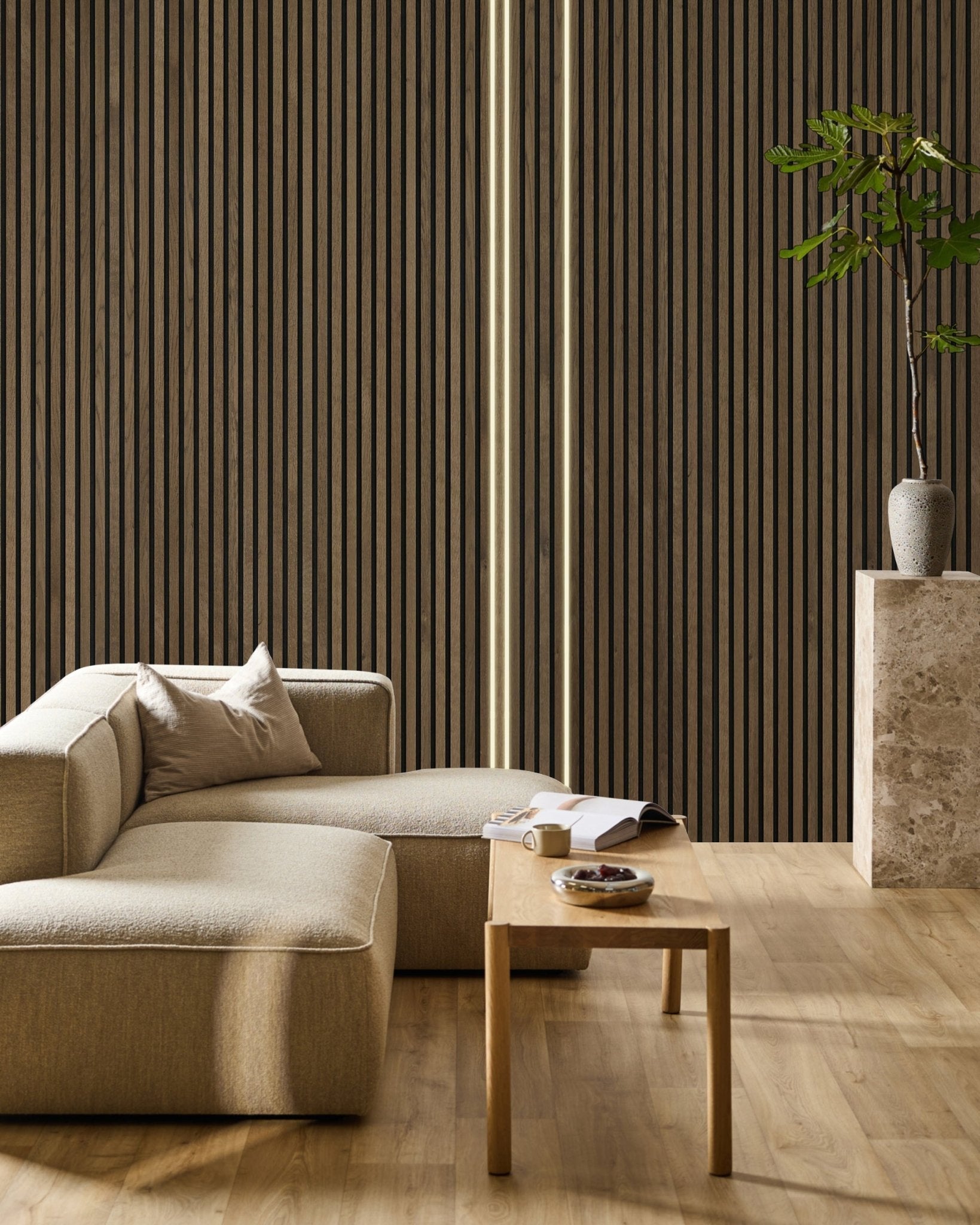 Minimalist living room with beige sofa, wooden table, open book, Akupanel acoustic wood panel wall by WoodUpp, and black Lumi LED striplights (3 x 300cm).